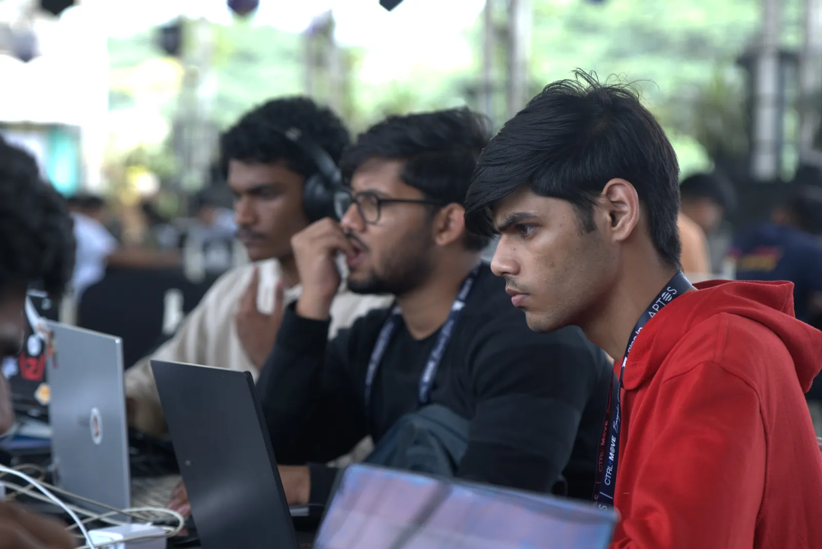 The team coding side by side on a hackathon floor