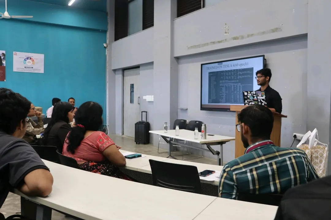 Ujesh presenting to a classroom