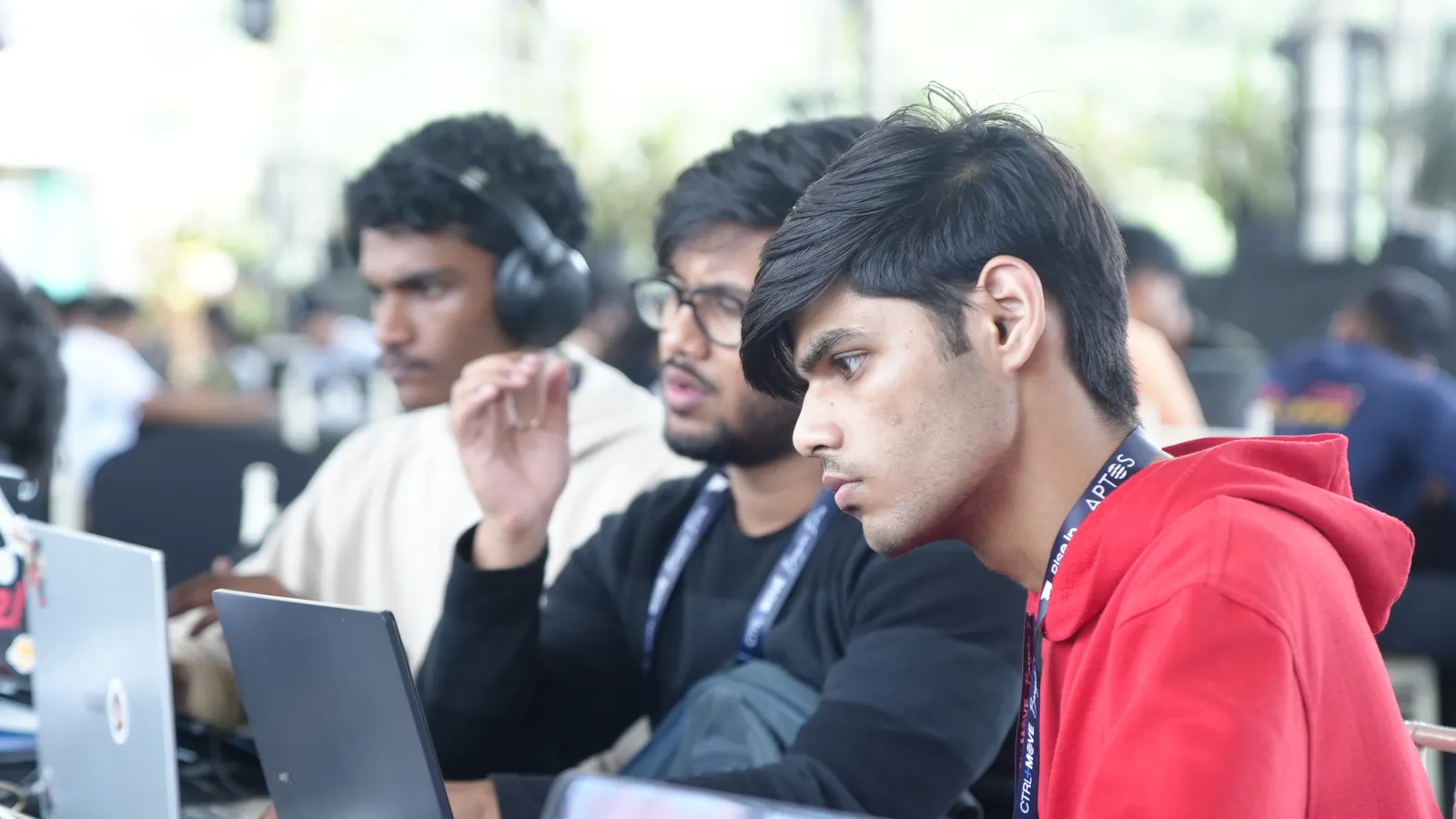 Teammates heads down at their laptops