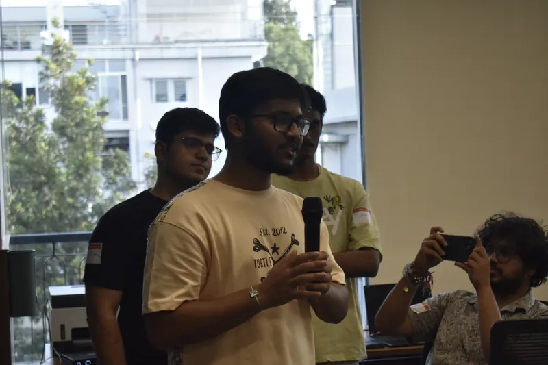 Ujesh pitching with a microphone