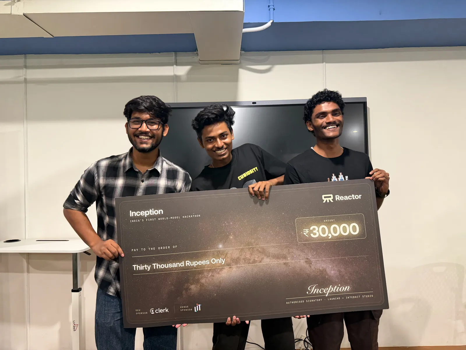 The Inception team with their cheque