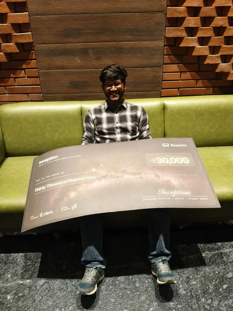 Ujesh with the Inception winner's cheque
